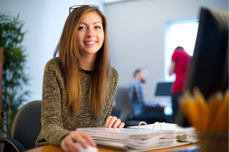 A new team member at her desk